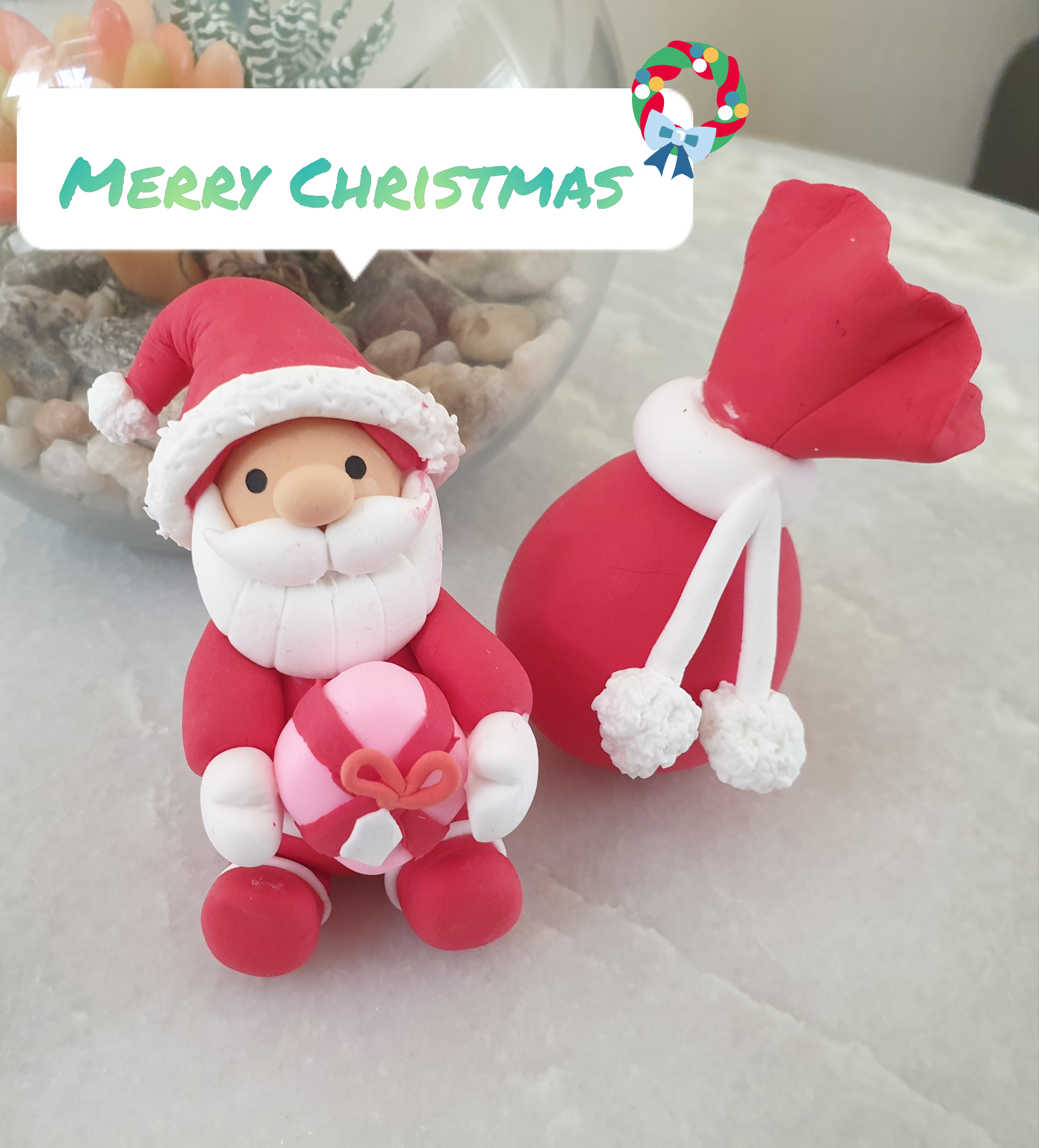 Paper clay Santa Claus figurine with gift sack