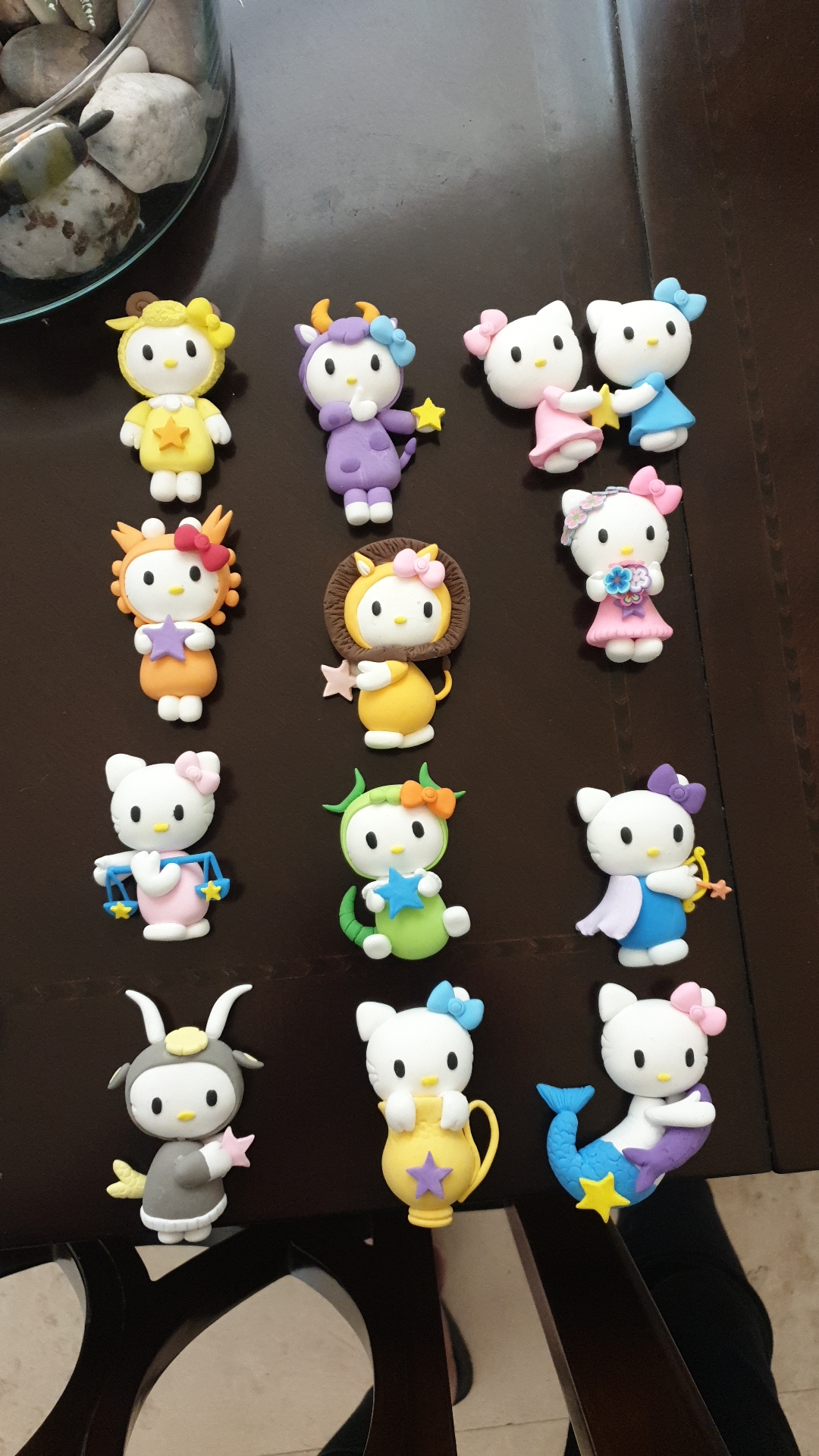 Zodiac kitty figurines in twelve astrological costumes
